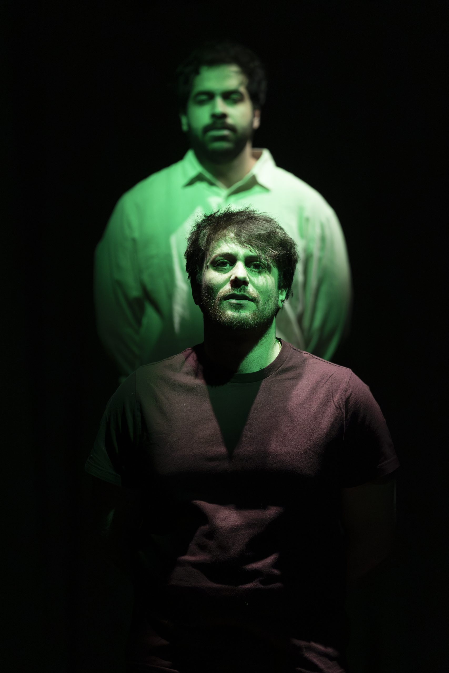 Yusuf Zine as Malek standing behind Andrew Iles as Malek