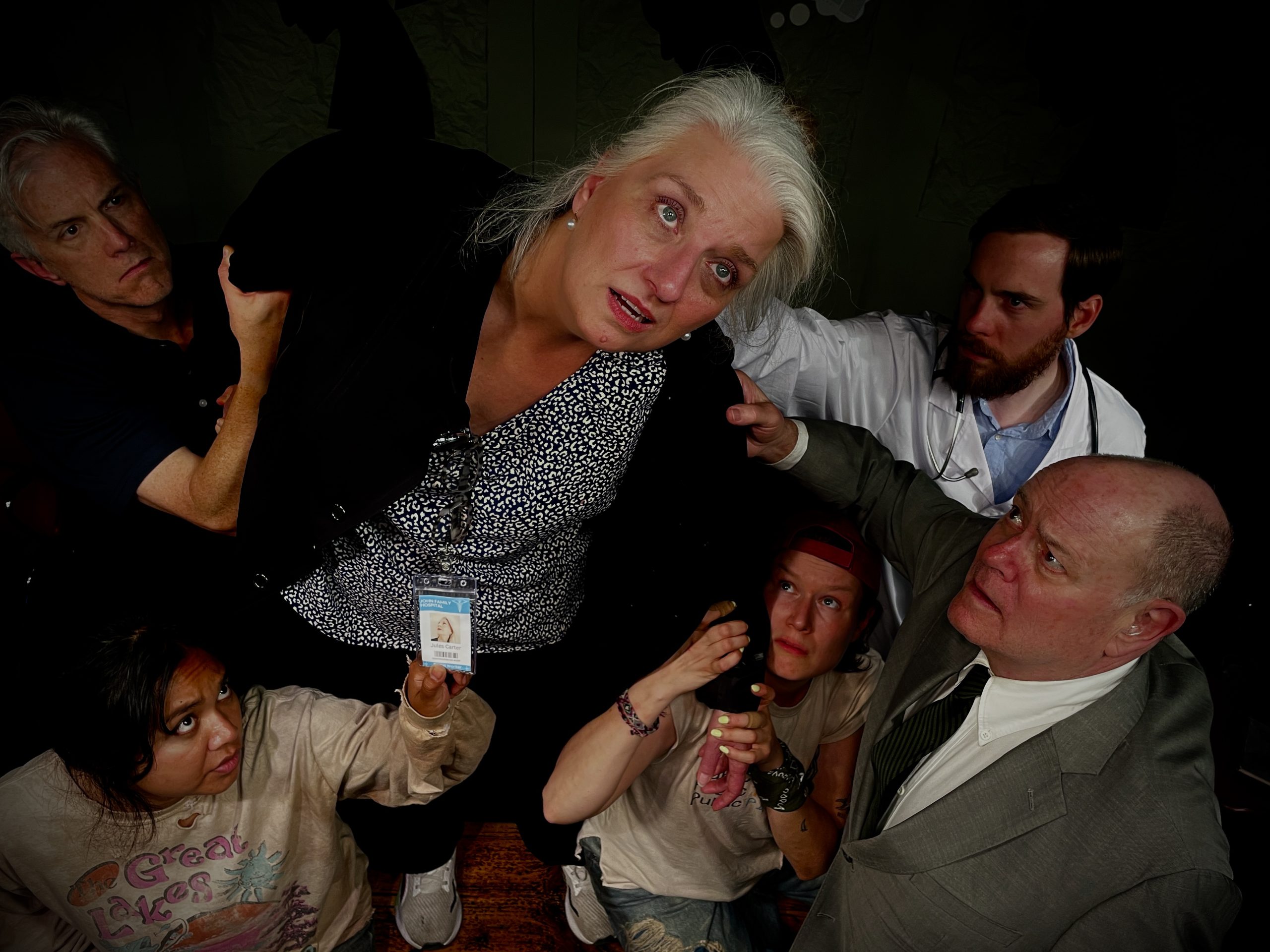 Various patients ranged around social worker trying to get her attention,