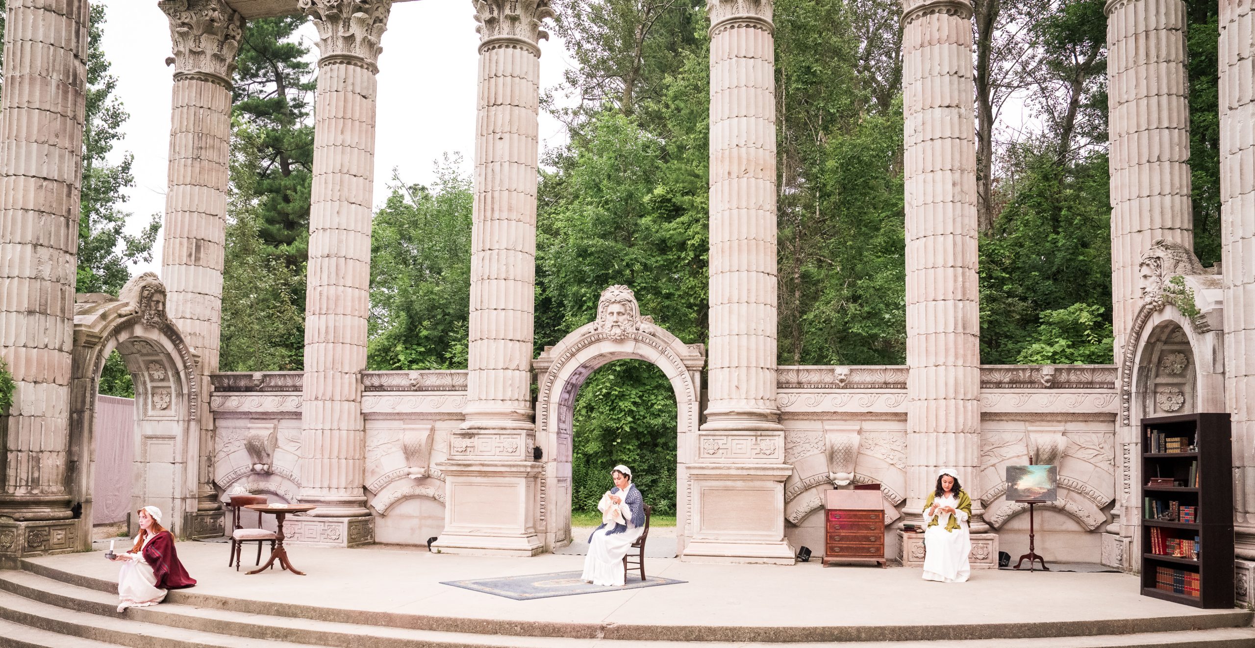 Wide shot of the Greek Theatre showing the set of Brontë, The World Without with the sisters scattered across the stage