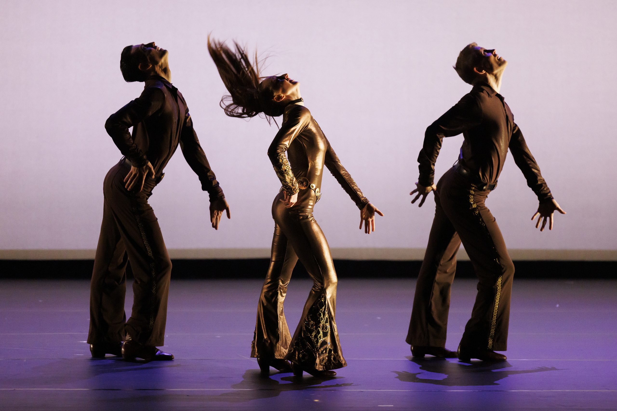 Three dancers from Hubbard Street Dance Chicago in typically Bob Fosse stance